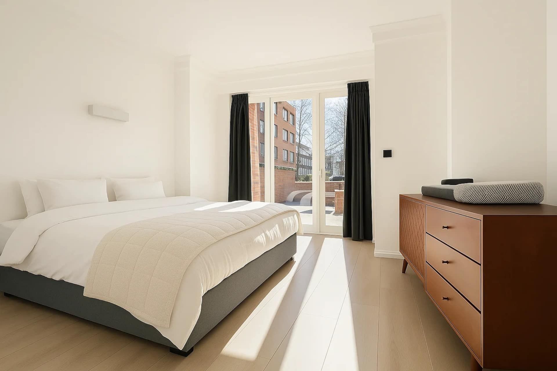Bedroom with a double bed and glass doors
