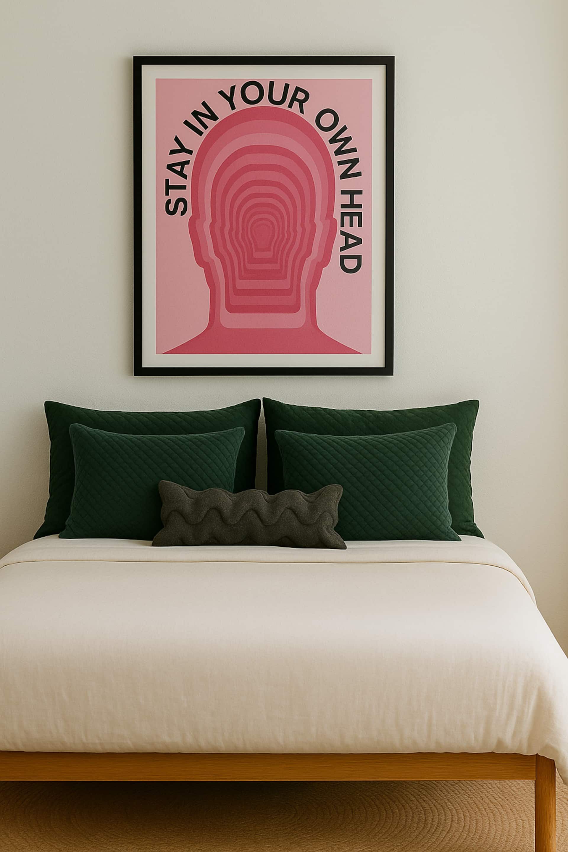 Double bed with green cushions