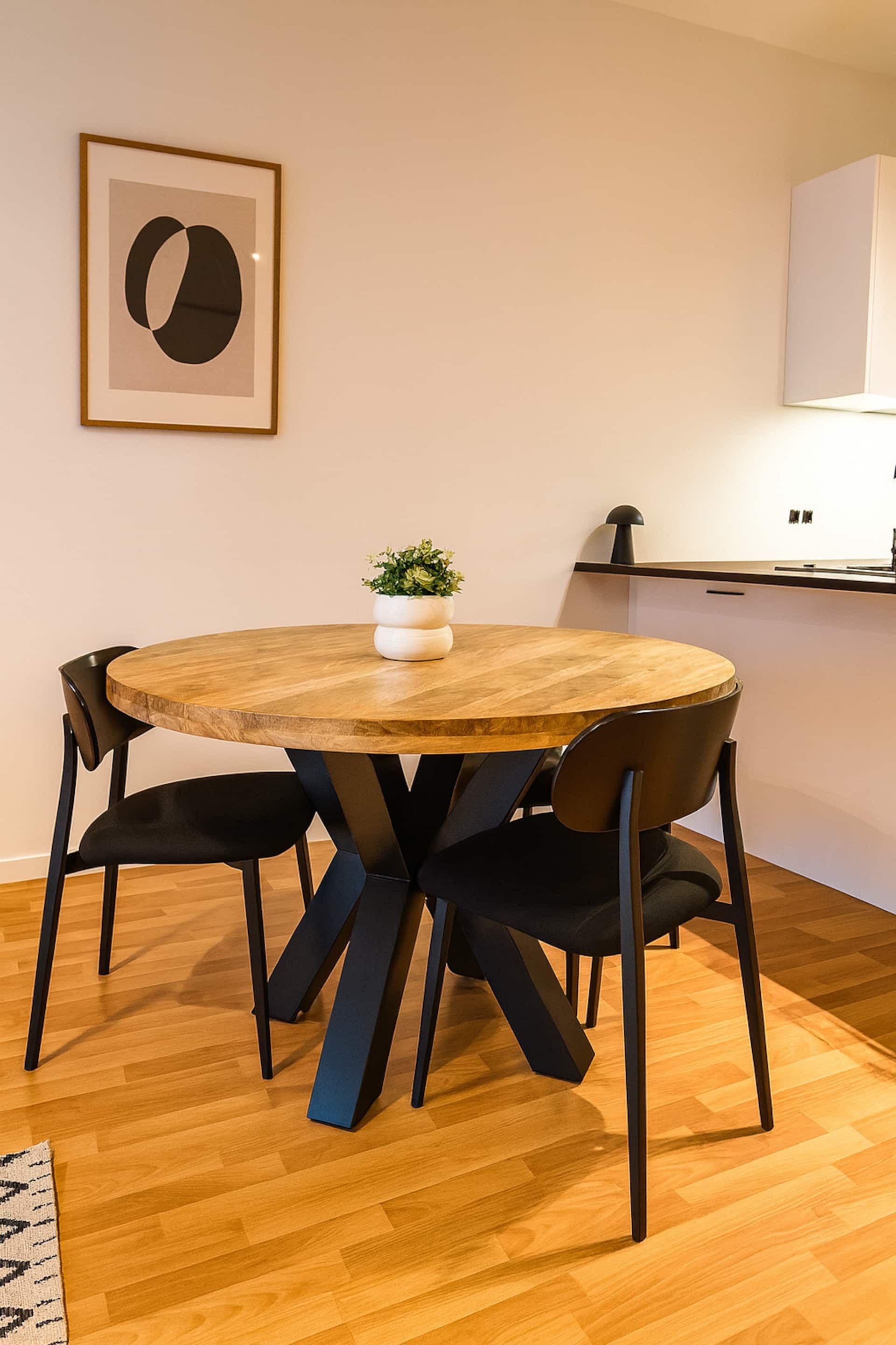 Round dining table with four chairs