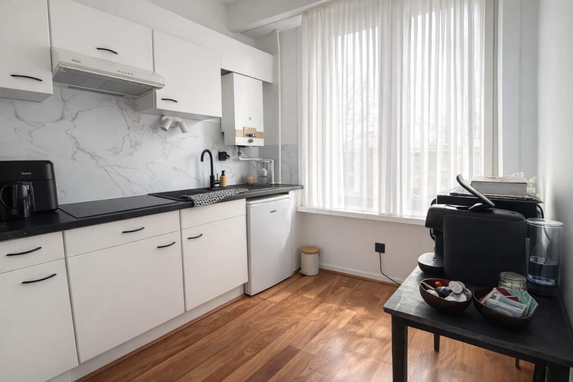 Kitchen with a window and dining table